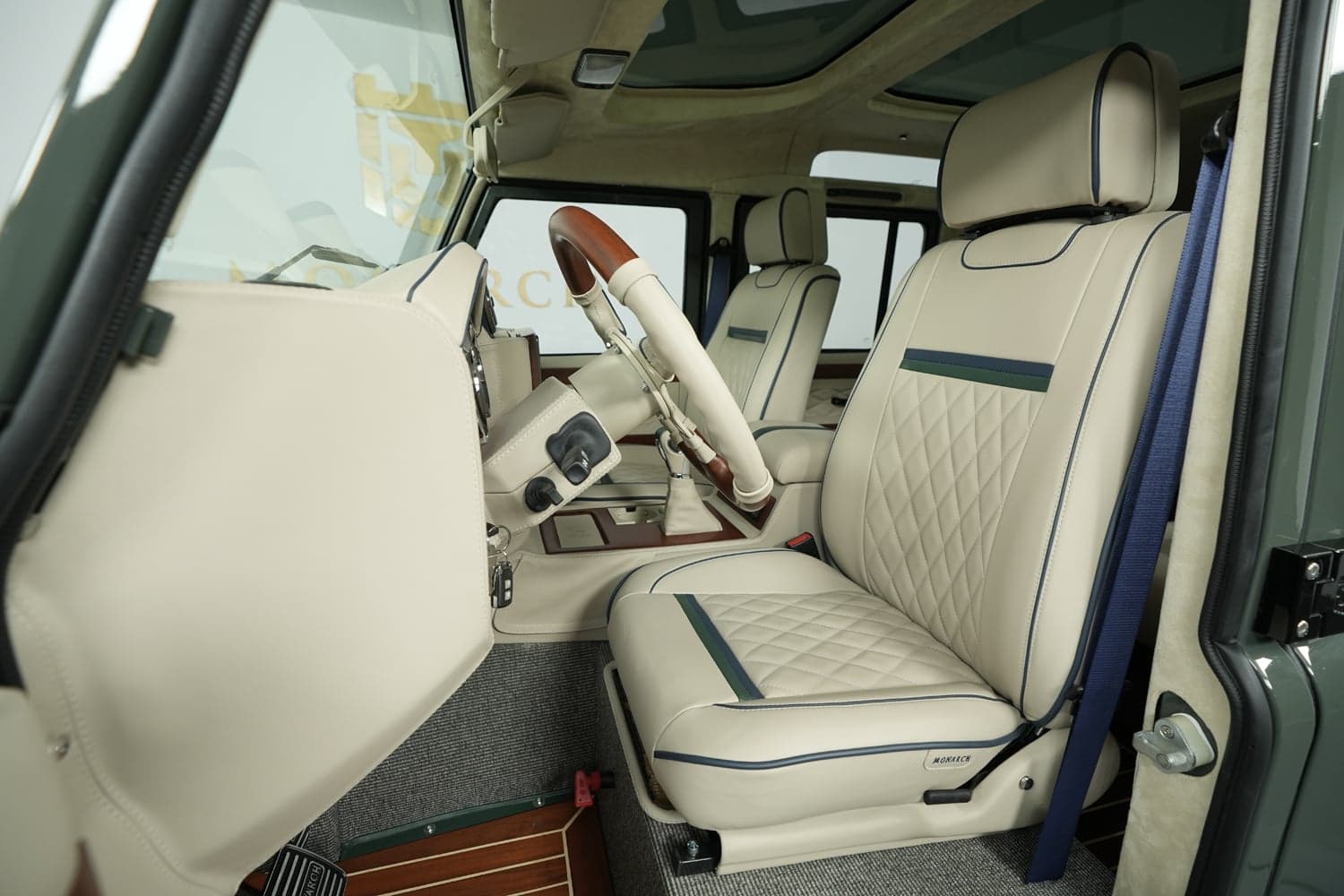 Bespoke Land Rover Defender interior featuring premium leather seats and wooden accents