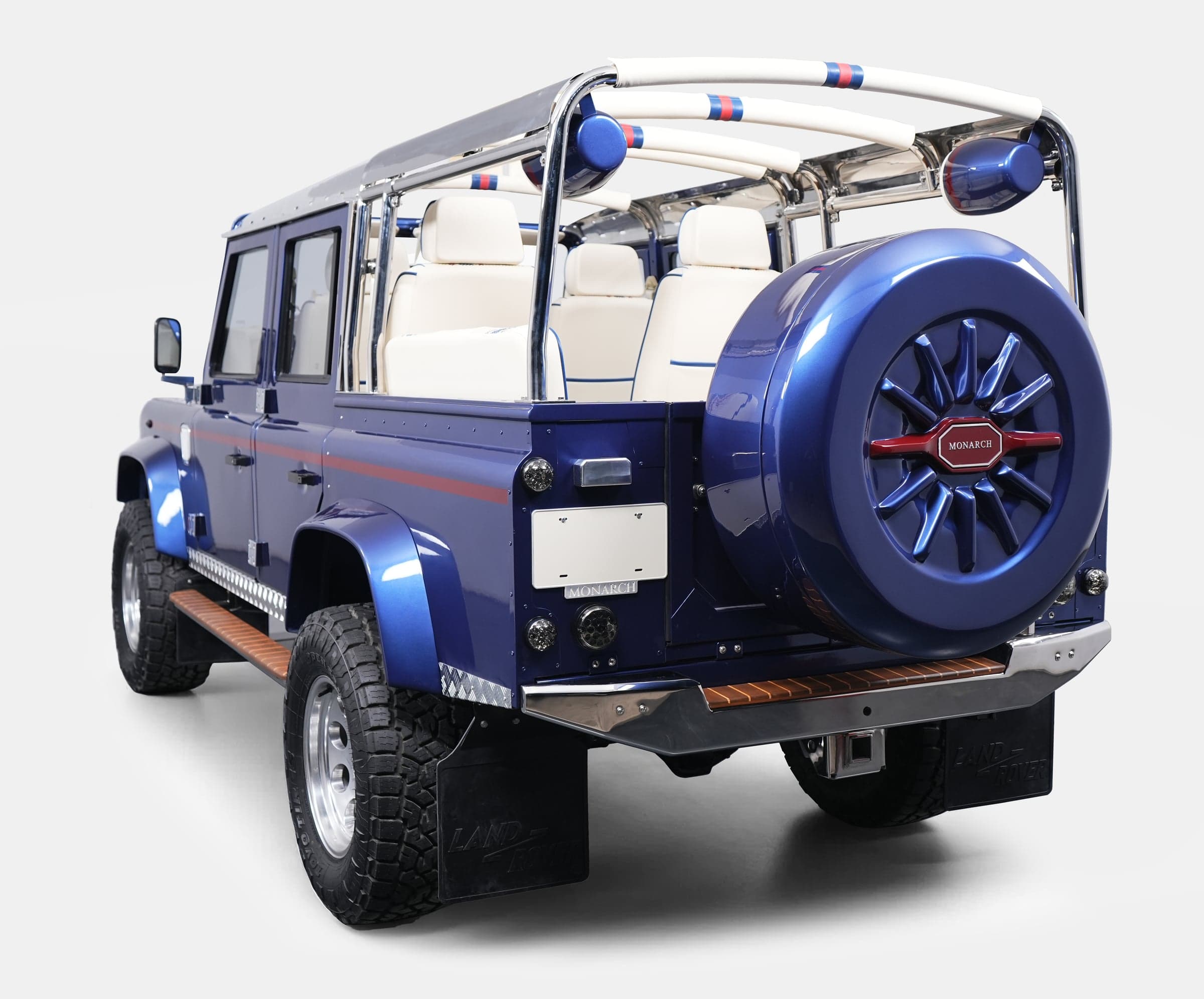 Custom Land Rover Defender in blue with white interior and chrome details