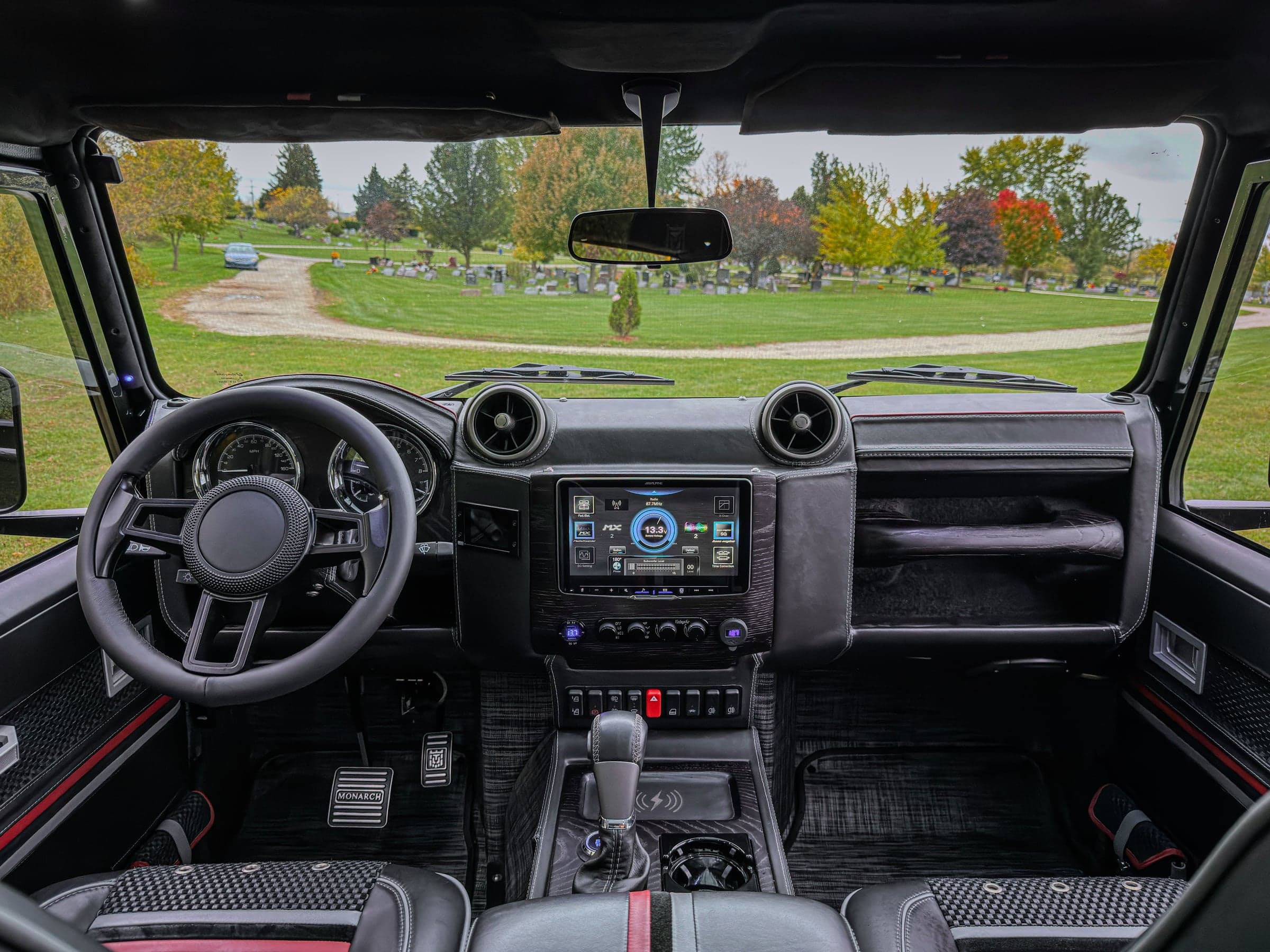 Interior view of a custom Land Rover Defender featuring premium materials and advanced technology
