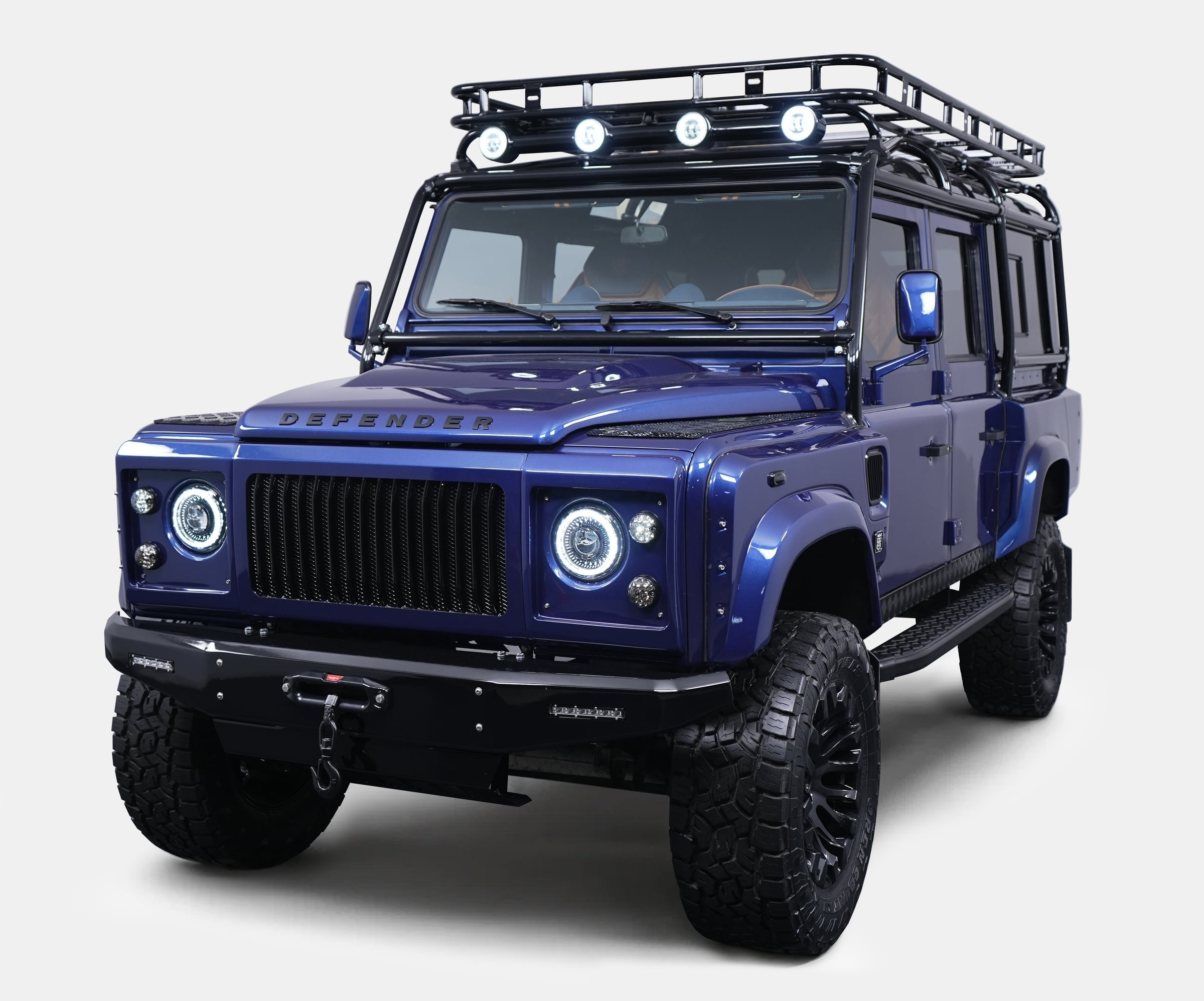 Custom Land Rover Defender in striking blue with off-road features