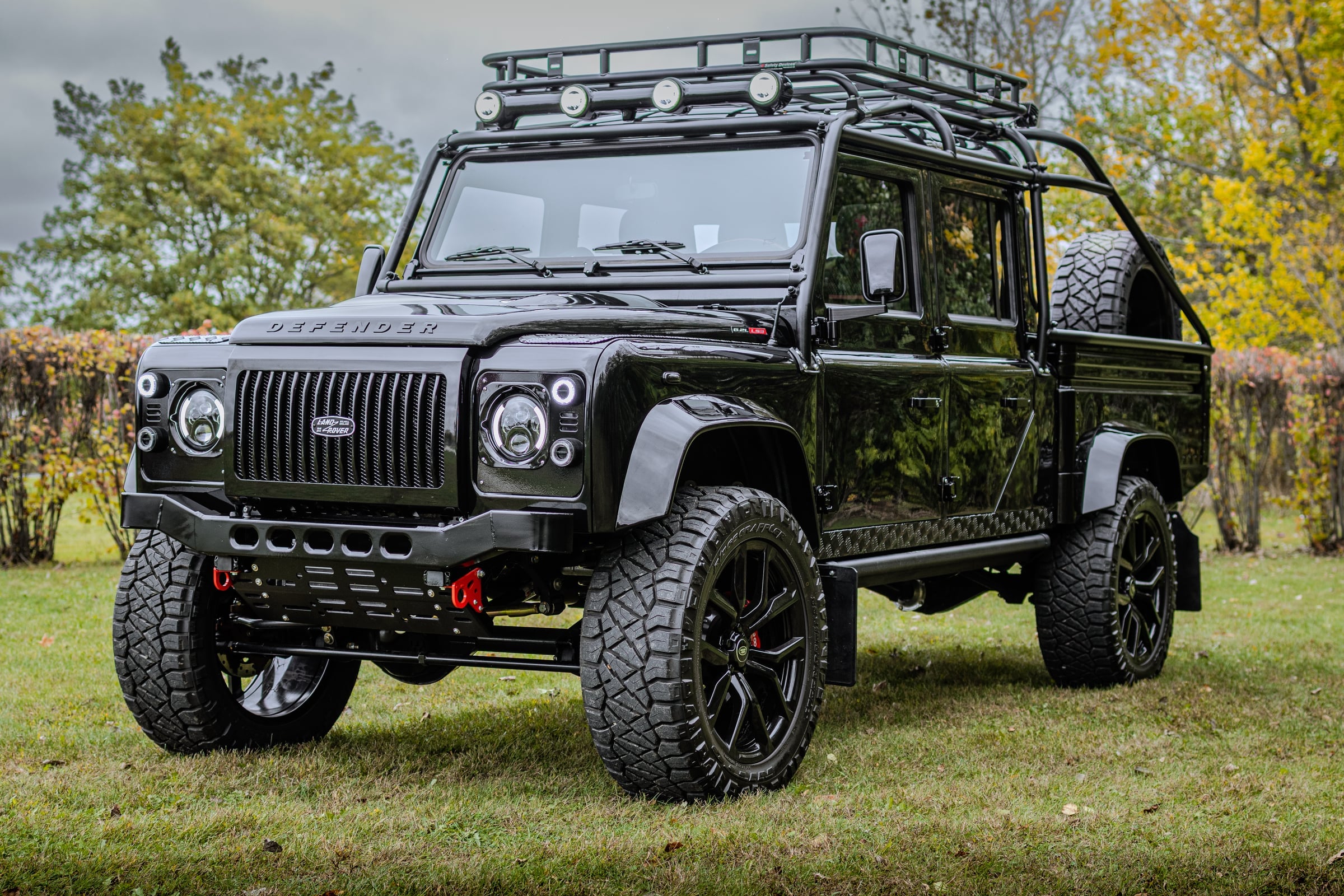 Bespoke black Land Rover Defender with rugged design and off-road capabilities