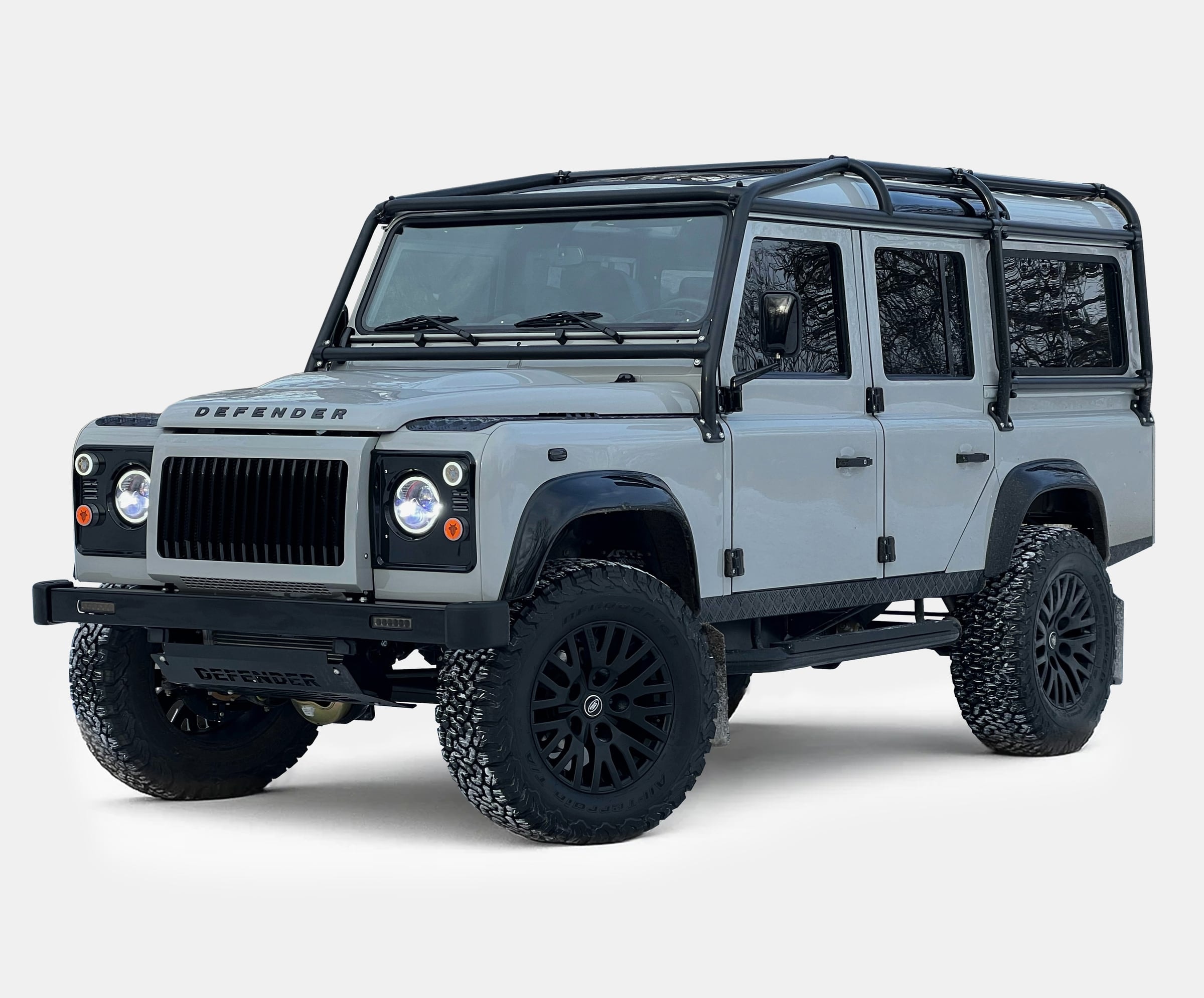 Bespoke Land Rover Defender in gray with black accents and custom wheels