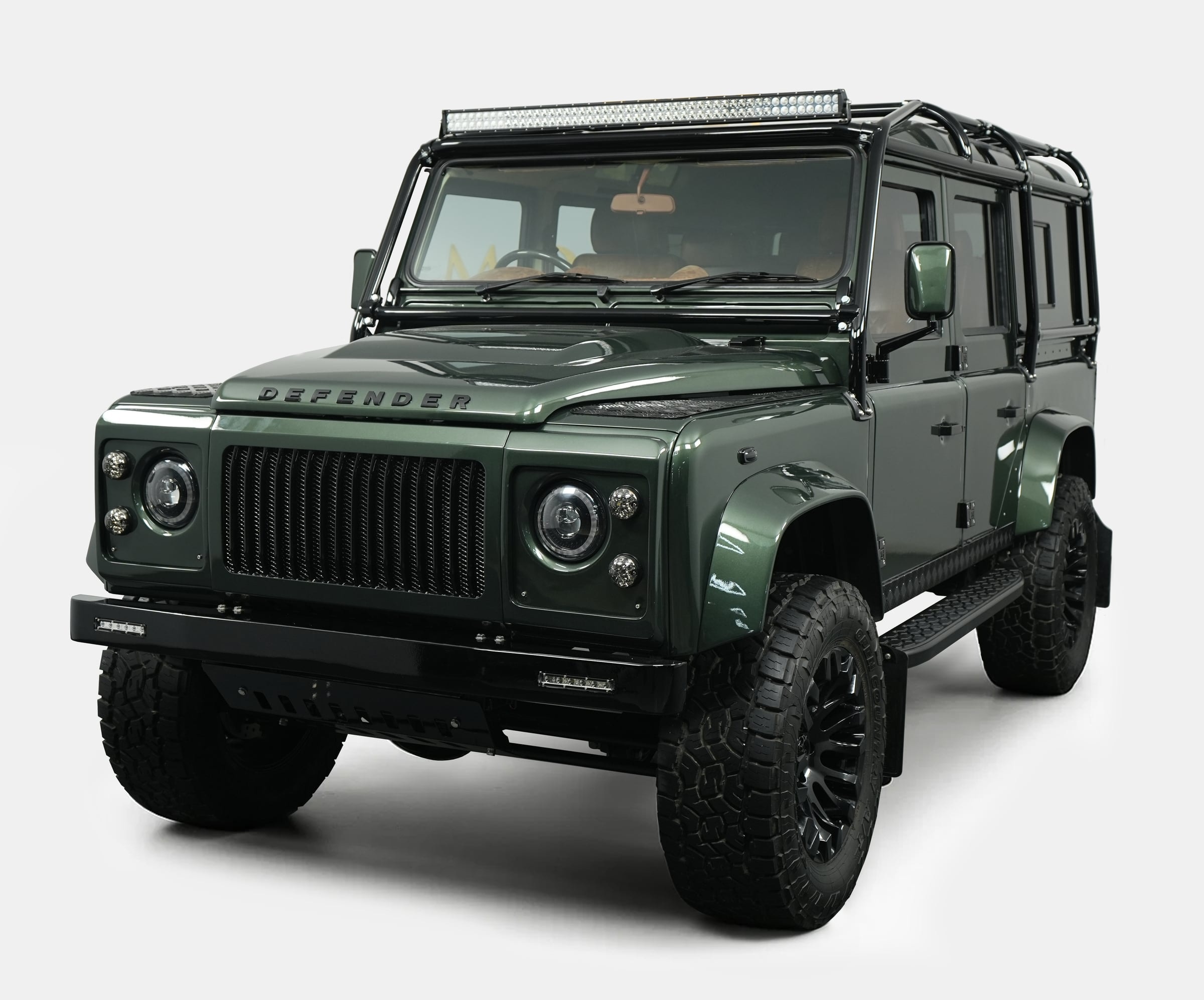 Custom Land Rover Defender in green with premium details