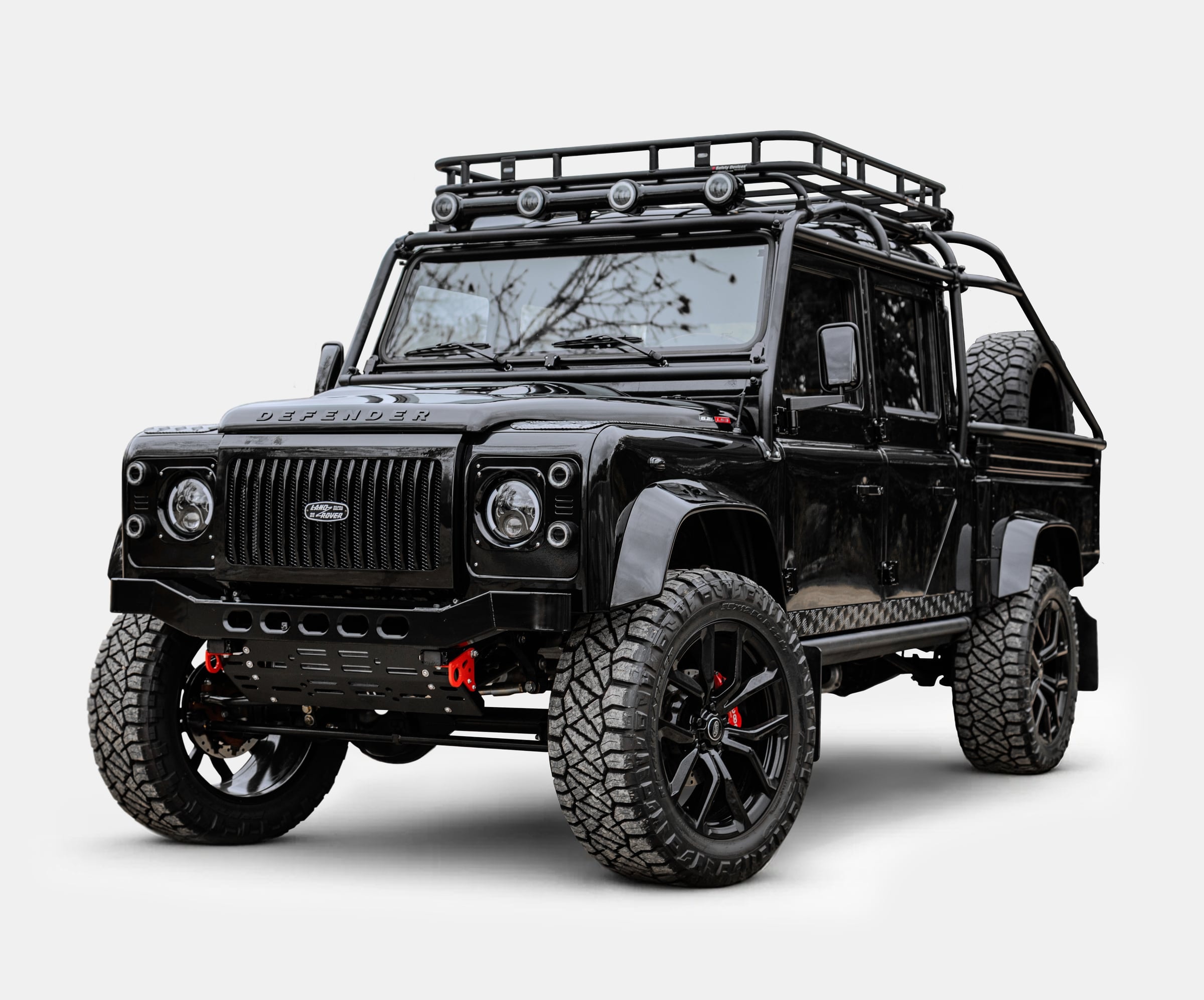 Custom black Land Rover Defender with off-road features