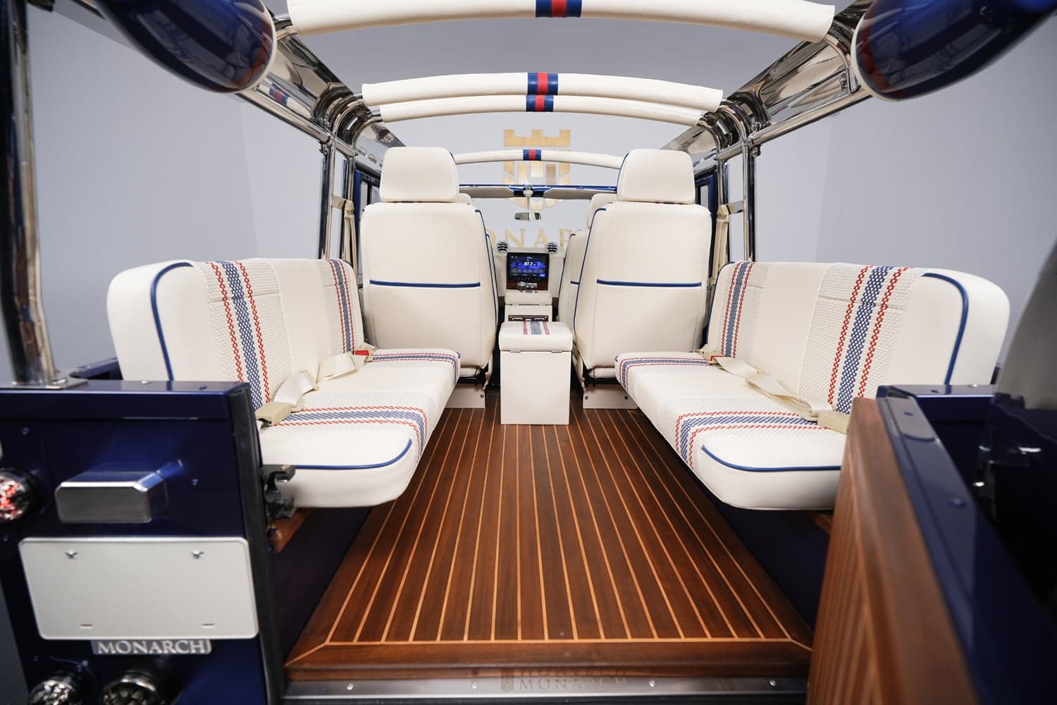 Interior Shot: Luxury Cabin Bespoke Land Rover Defender interior featuring premium seating and wood flooring