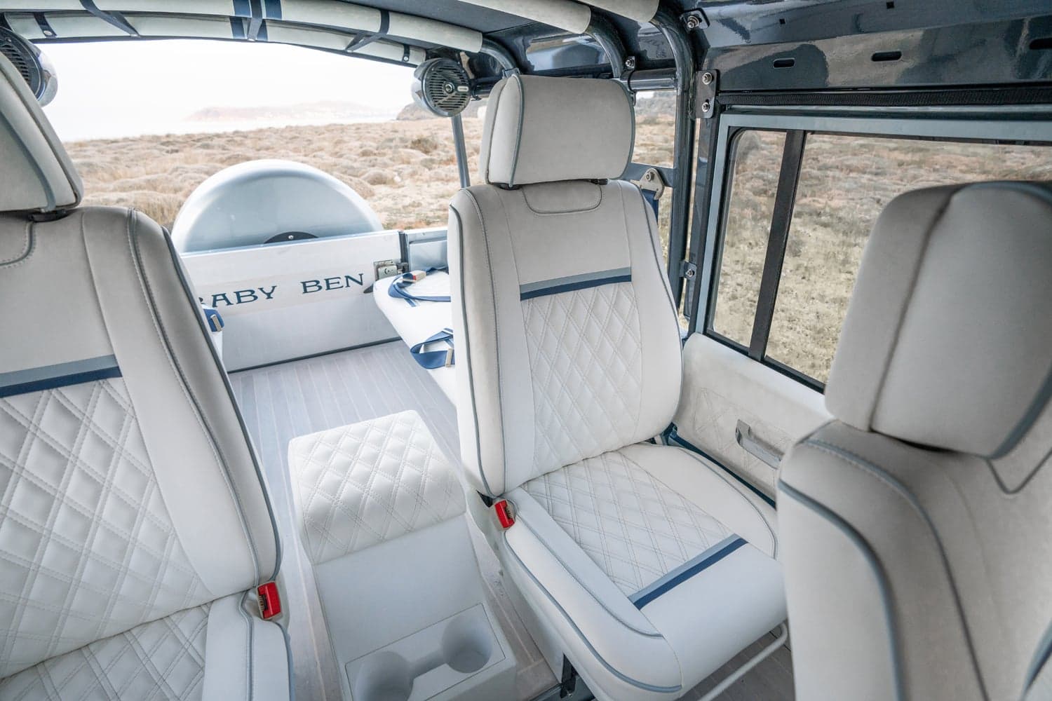 Interior Shot: Luxury Seating Bespoke Land Rover Defender interior with premium quilted leather seats