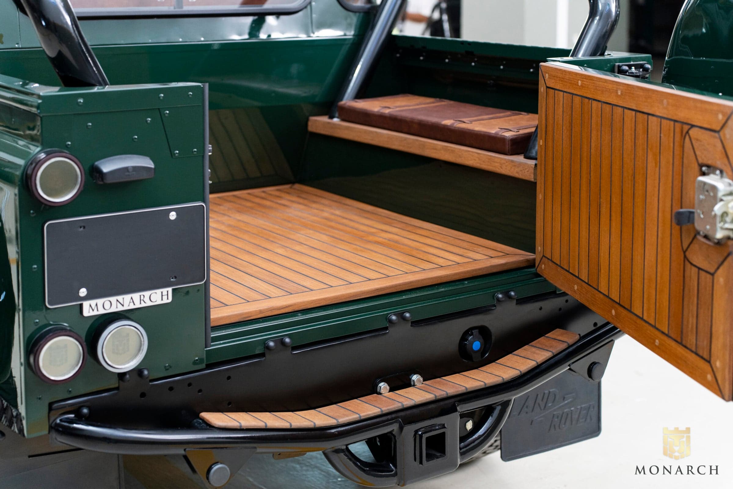 Interior Shot: Custom Cargo Area Luxury Land Rover Defender cargo area with wooden flooring and custom features