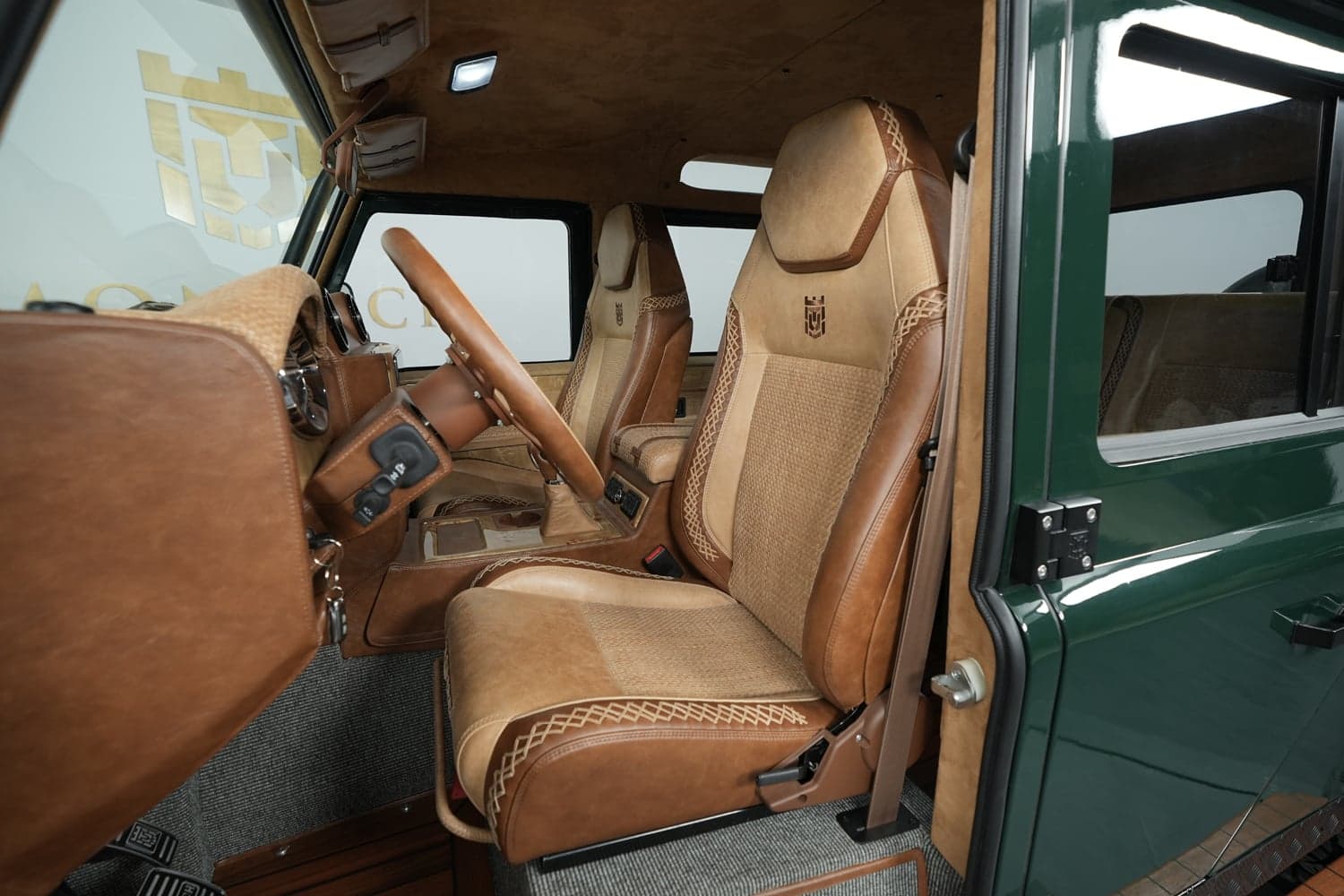 Interior Shot: Luxurious Cabin Design Custom Land Rover Defender interior featuring premium leather seats and detailed craftsmanship