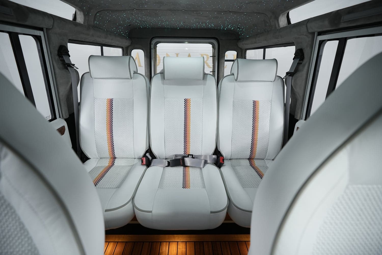 Interior Shot: Luxury Seating Custom Land Rover Defender interior featuring luxury white leather seats with intricate detailing