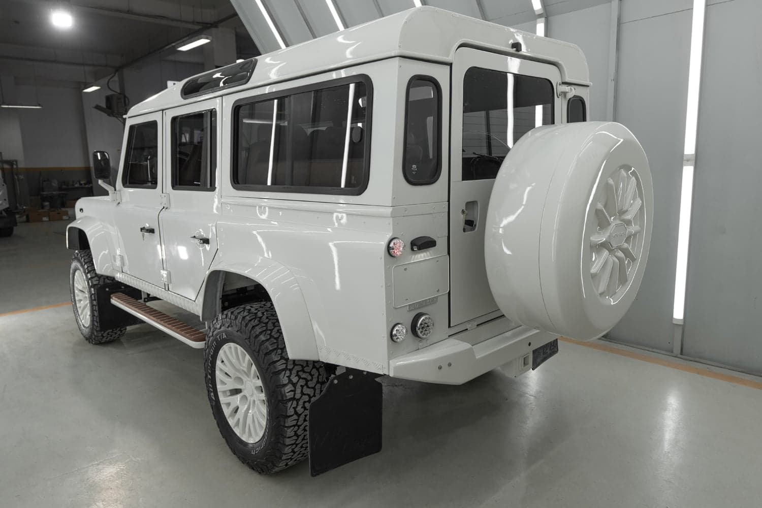 Rear View: Custom Land Rover Defender Rear view of a bespoke white Land Rover Defender with distinctive design features