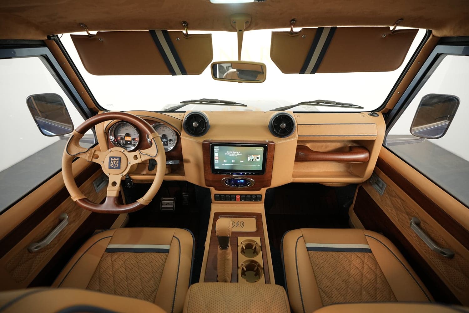 Interior Shot: Luxury Cabin Design Bespoke Land Rover Defender interior featuring premium leather and wood accents