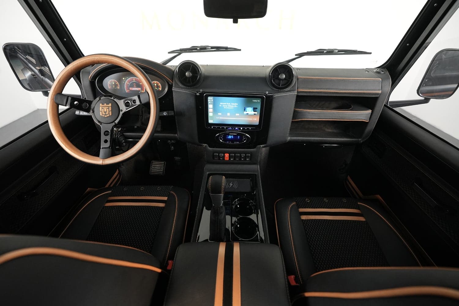 Interior Shot: Luxury Cabin Design Bespoke Land Rover Defender interior showcasing premium materials and modern technology