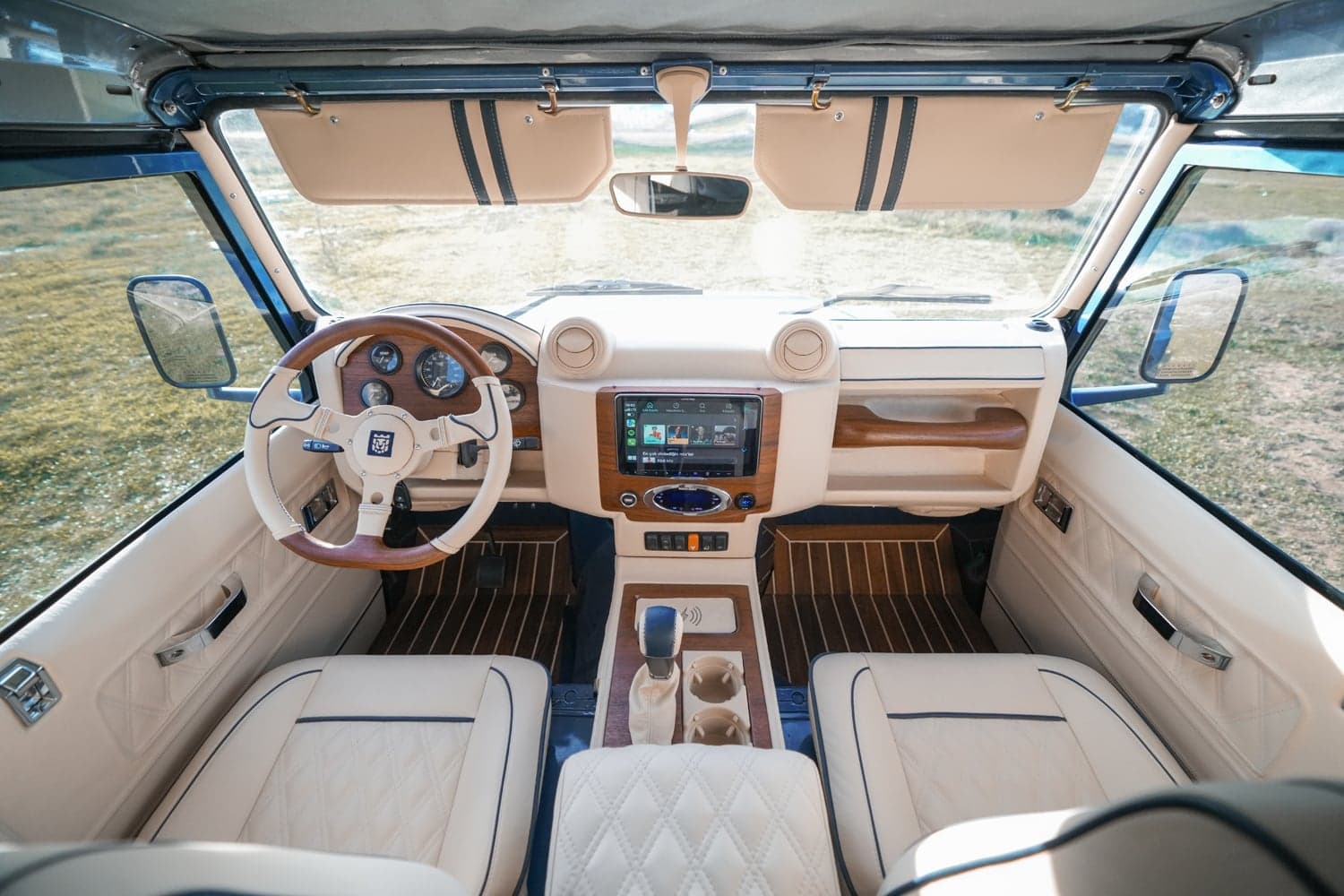 Interior Shot: Luxury Cabin Luxury Land Rover Defender interior with premium leather seats and modern dashboard