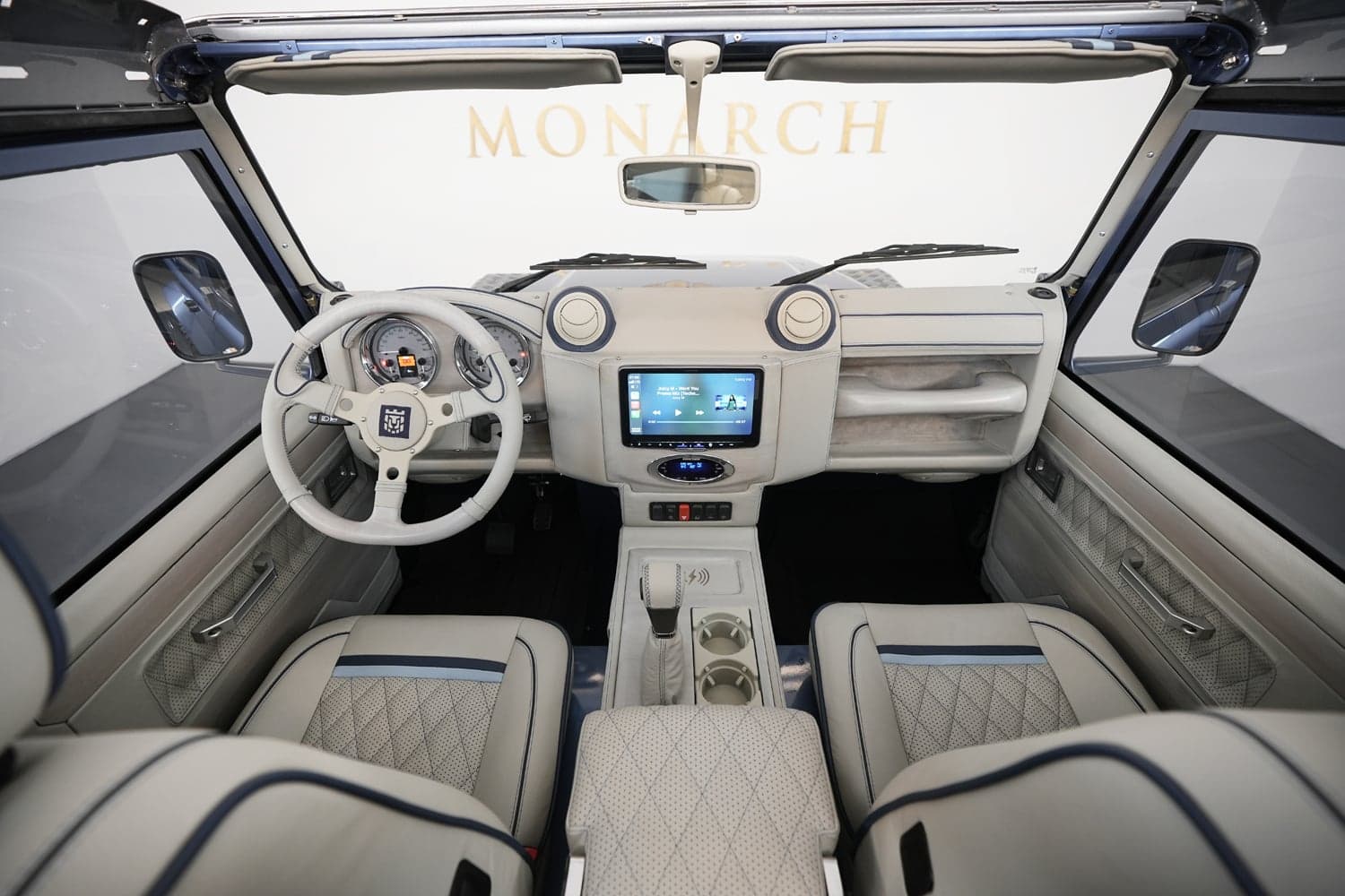 Interior Shot: Luxury Cabin Bespoke Land Rover Defender interior featuring premium leather and modern technology