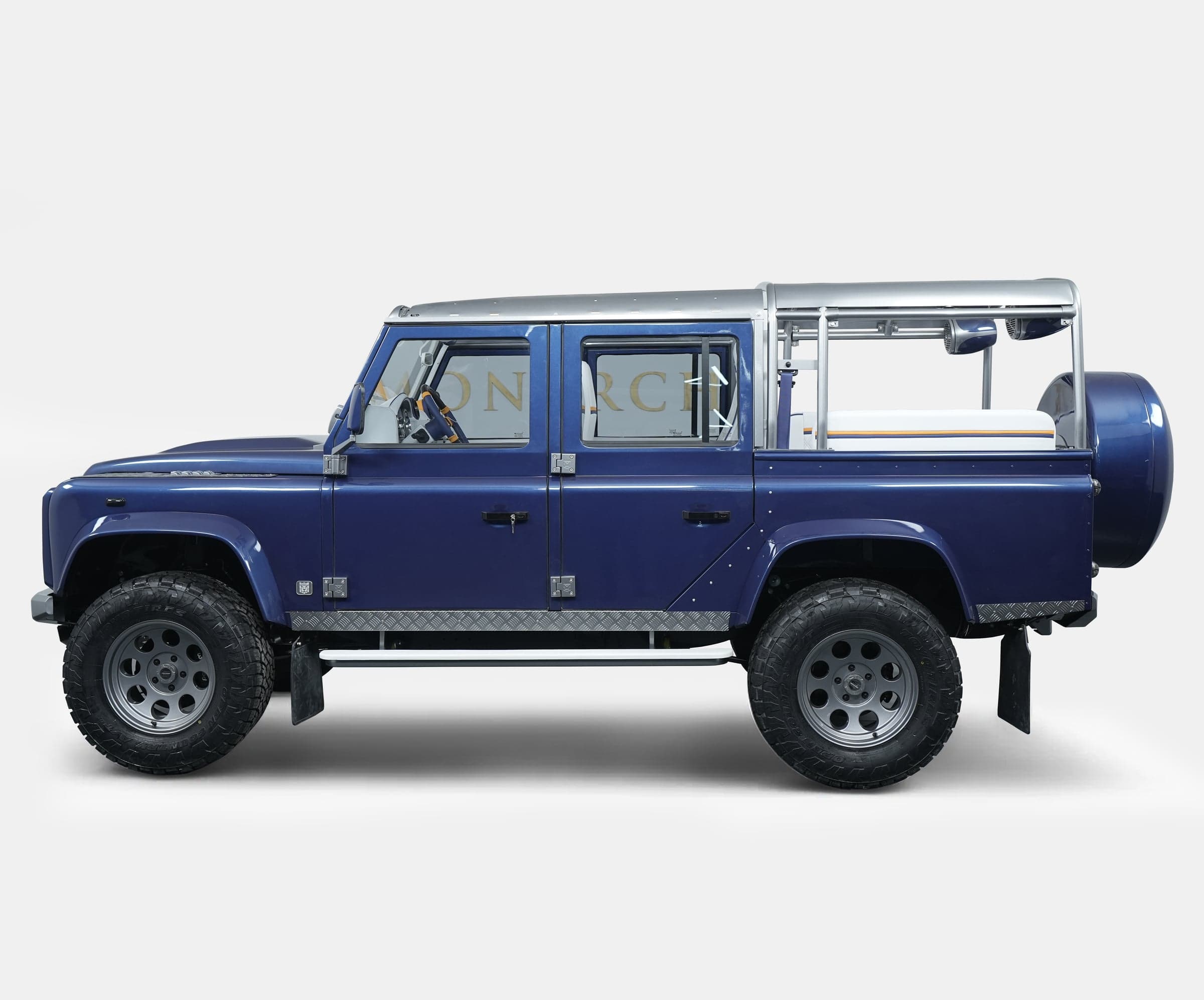 Side View: Bespoke Land Rover Defender Custom Land Rover Defender in blue with unique design features