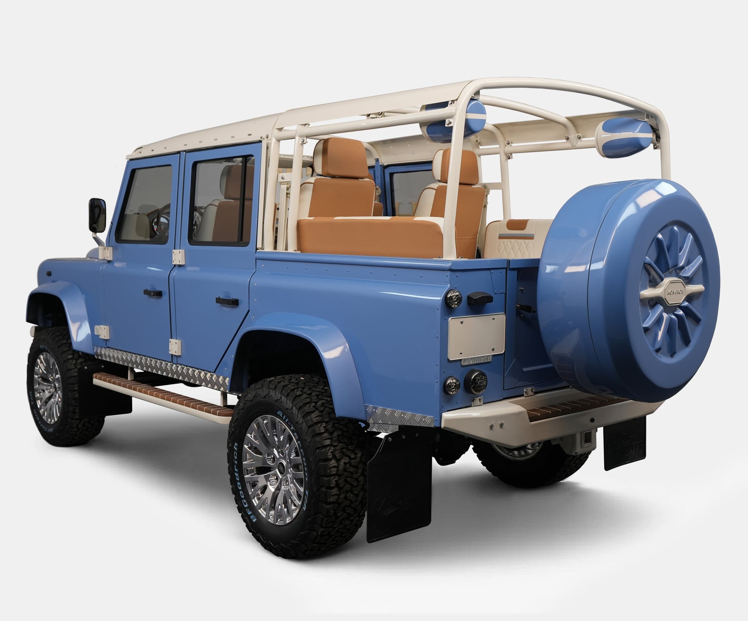 Rear View: Custom Blue Land Rover Defender Custom blue Land Rover Defender with tan interior and chrome wheels