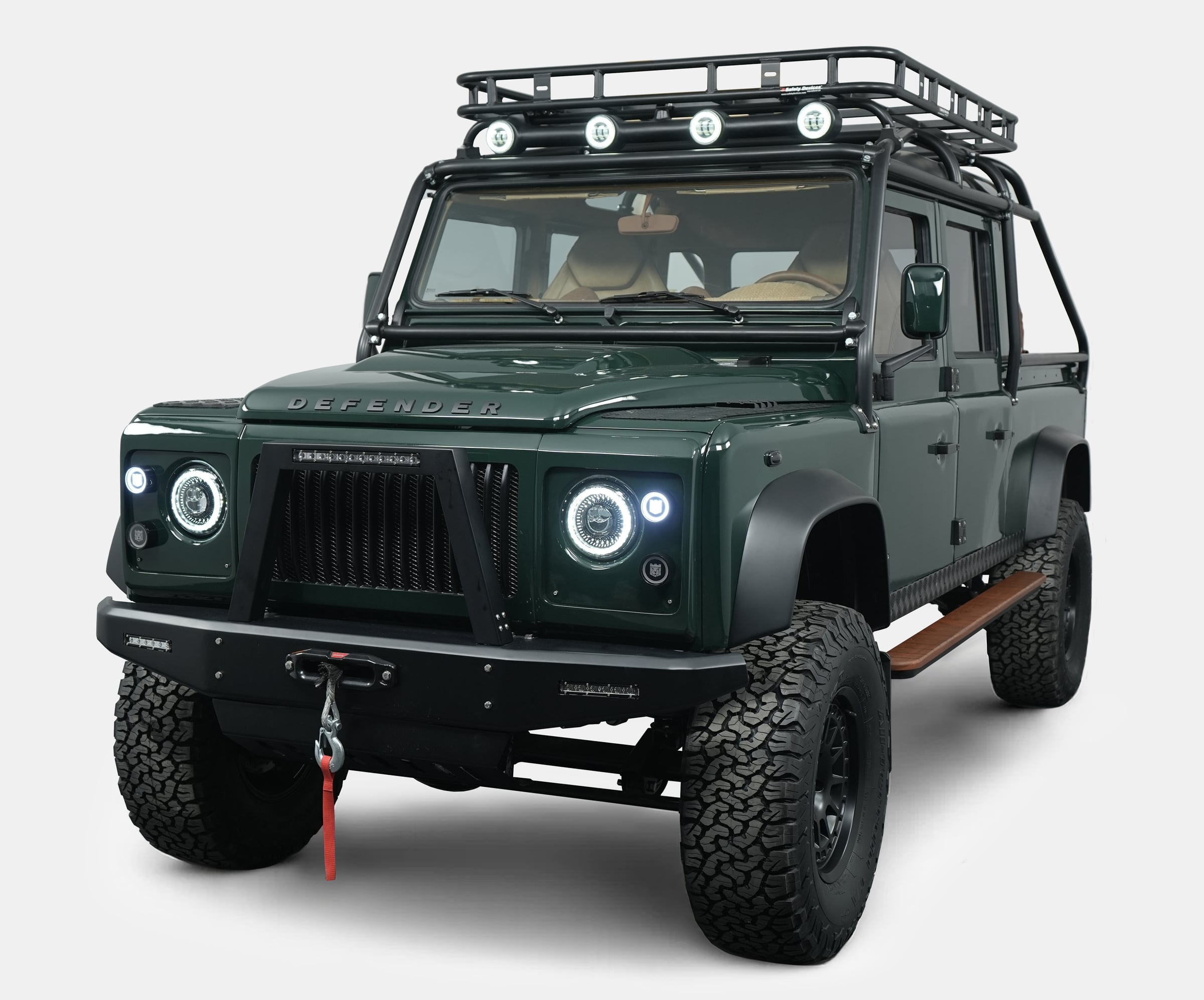 Front View: Bespoke Land Rover Defender Custom Land Rover Defender in dark green with off-road modifications