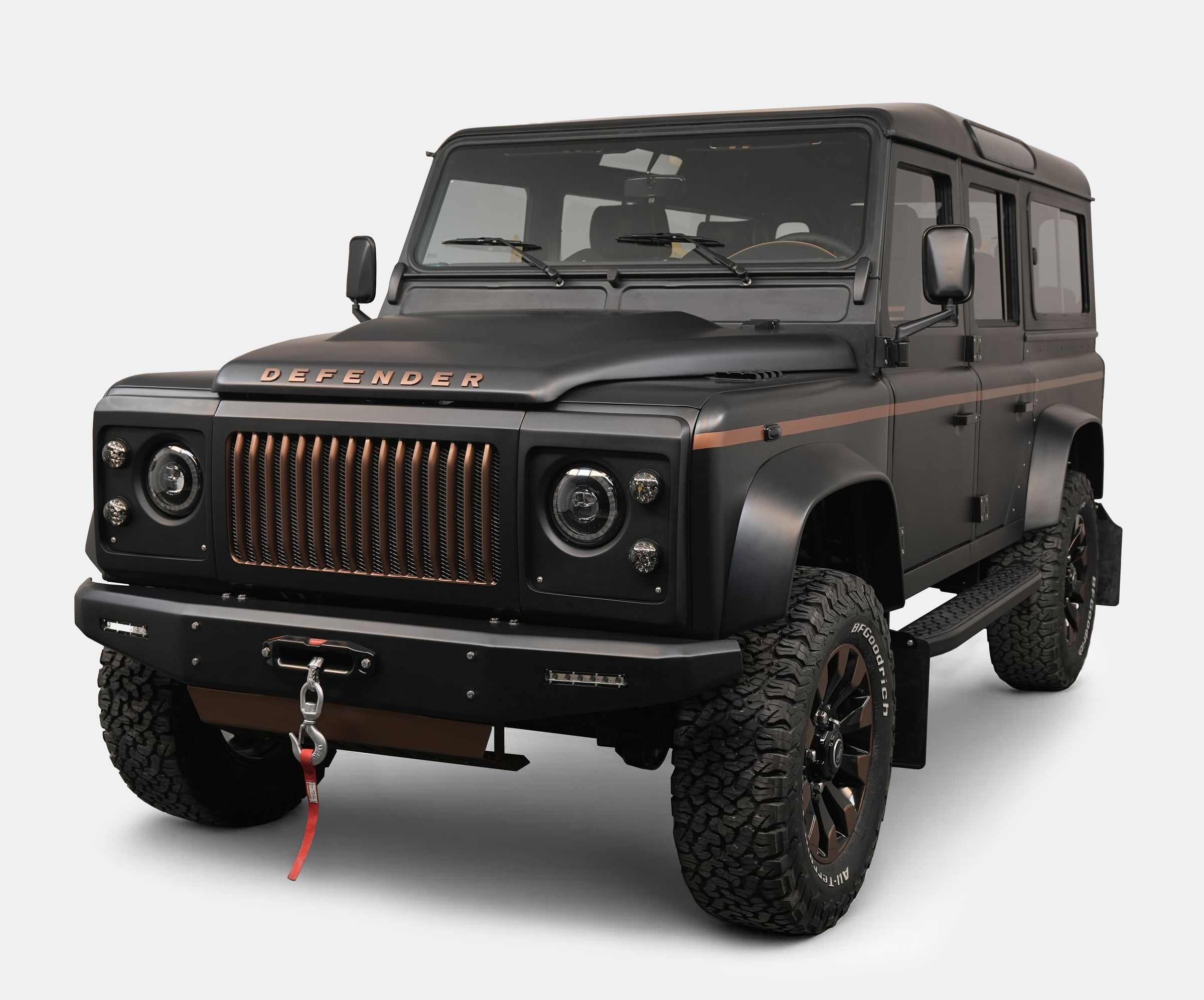 Front View: Bespoke Land Rover Defender Custom Land Rover Defender in matte black finish with copper accents