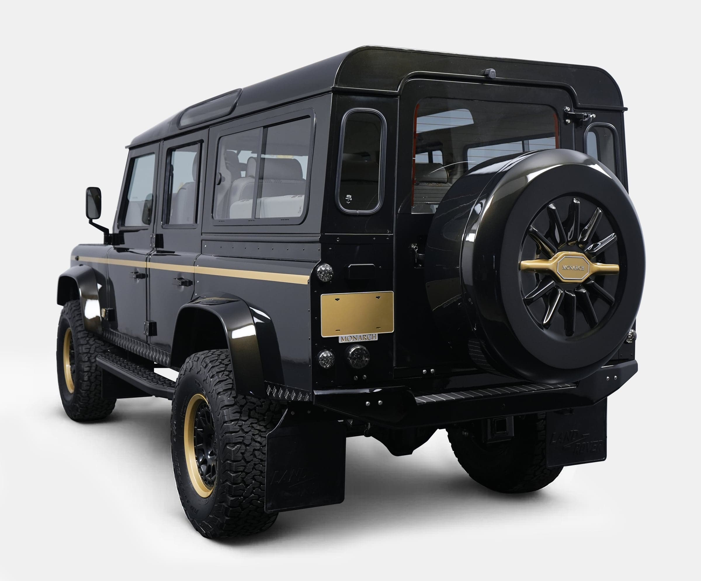 Rear View: Custom Land Rover Defender Bespoke Land Rover Defender in black with gold accents
