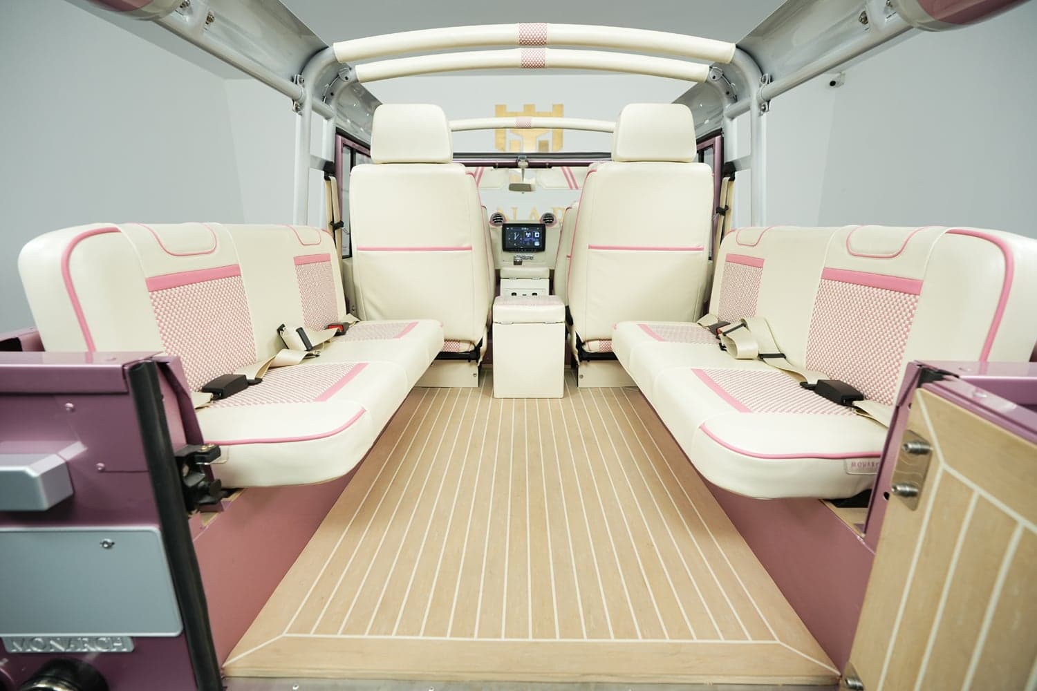 Interior Shot: Custom Luxury Seating Bespoke interior of a luxury Land Rover Defender featuring cream and pink leather seats